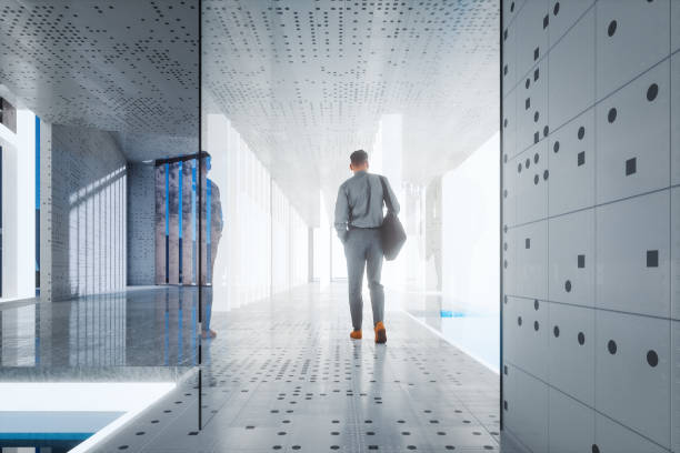istock Businessman walking in modern office building 1446301460