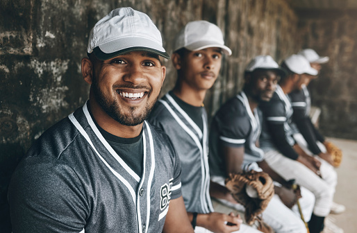 Happy man, baseball player and team sports portrait, motivation and confidence for competition game. Smile professional athlete waiting on bench with group for performance, outdoor match and training