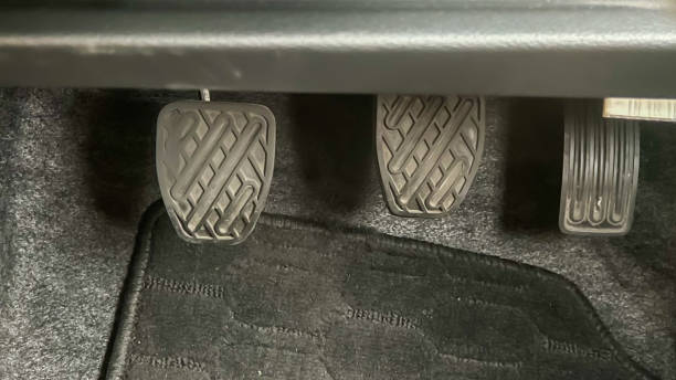 istock three manual car pedals: clutch, brake and accelerator 1446305988