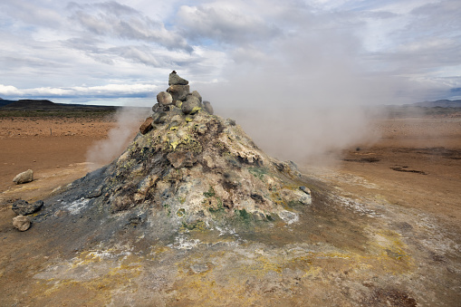 Steaming fumarole at Hverir, Iceland popular geothermal area near Myvatn with unique landscape of steaming pools and mudpots