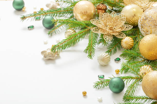 istock golden and green  christmas decorations  on white  background 1446313876