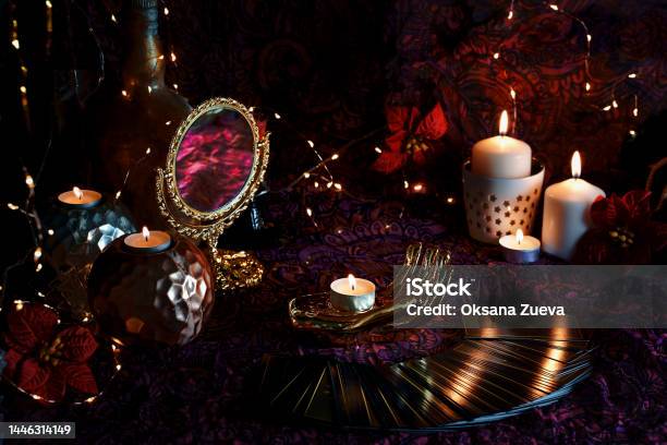 Blurred Tarot Cards On Table Near Burning Candles Tarot Reader Or Fortune Teller Reading On Christmas Decoration Stock Photo - Download Image Now