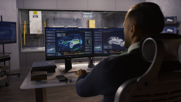 Engineer in crash test lab An engineer in a crash test lab uses a car crash test system to simulate a traffic accident, to obtain the safety parameters of an eco-friendly cutting edge electric vehicle being developed. industrial designer stock pictures, royalty-free photos & images