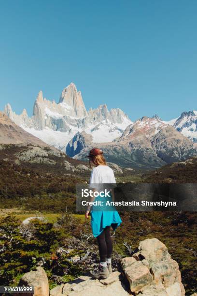 Rear View Of A Woman Contemplating A View Of Fitz Roy Mountains In Patagonia During The Hiking Trip Stock Photo - Download Image Now