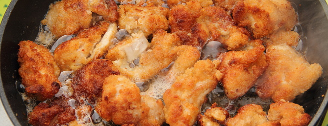 fresh chicken nuggets in the pan