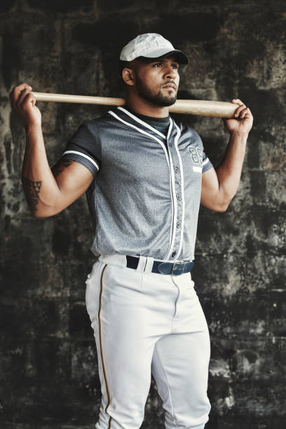 istock Man, baseball and bat while thinking, focus and determination in match, game or sport. Baseball player, serious and contemplating in sports, tournament or competition for championship 1446320830