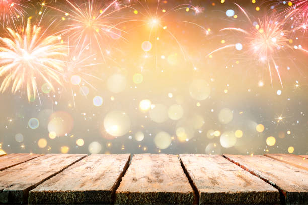 Celebration Table With Fireworks With Abstract Defocused Lights stock photo