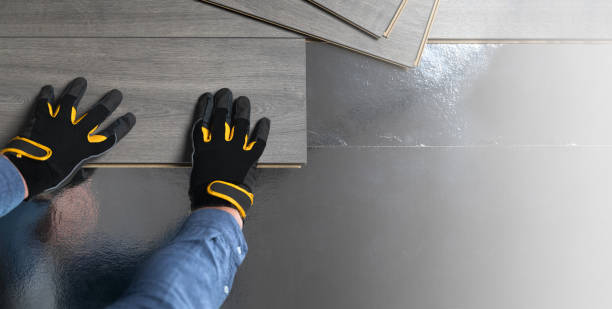 Installation of floating floor, underlay with sheets of laminate. Home improvement concept. Banner with copy space. Installation of floating floor, underlay with sheets of laminate. Home improvement concept. Banner with copy space. handyman stock pictures, royalty-free photos & images