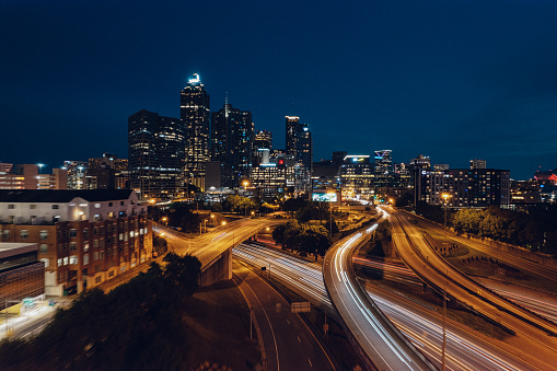 cars zooming through Atlanta city streets