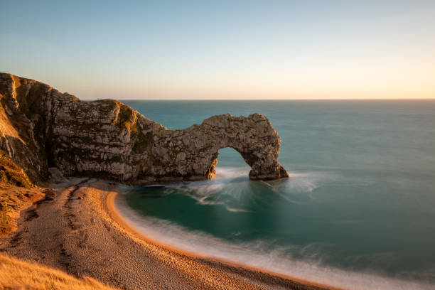 Long exposure of the calm sea at Durdle Door at dusk