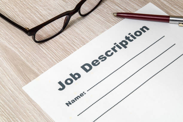 istock Job description form for filling with pen and glasses on table 1446327661