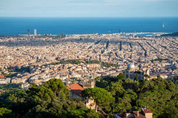 Barcelona seen from the Collserola mountain range at sunset with Fabra Observatory in the foreground. Spain