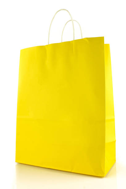istock Yellow blank paper bag isolated on white background. Shopping 1446328710