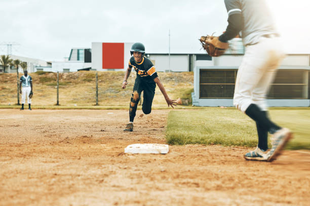 baseball, player and running on field for plate in game, match or contest. baseball player, team and pitch for sports, exercise and wellness in competition, tournament or event for sport outdoor - base runner imagens e fotografias de stock