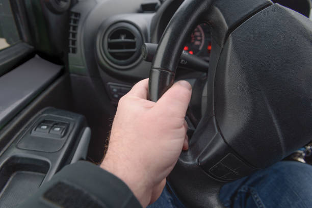 istock Strong grip on the steering wheel when turning 1446330543
