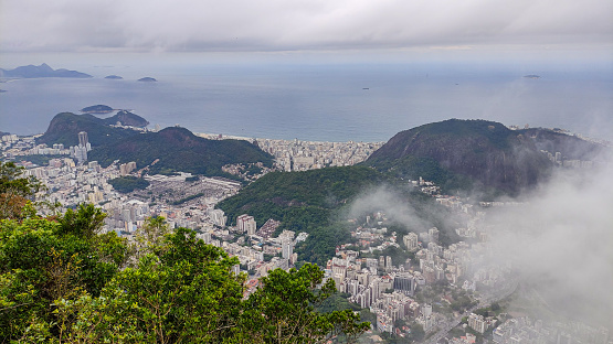 An aerial view of Rio de Janeiro shrouded in fog. Seen from the helipad area of Mirante Dona Marta, Rio de Janeiro, Brazil