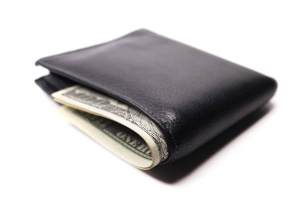 istock Full wallet with money american dollars isolated on white background 1446342340
