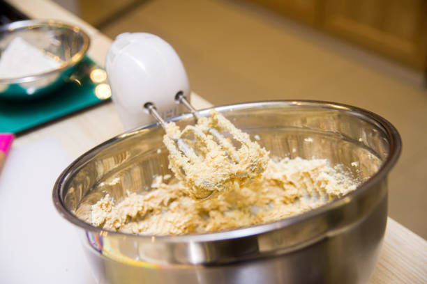 istock electric hand mixer kneads dough in a deep metal bowl 1446344477