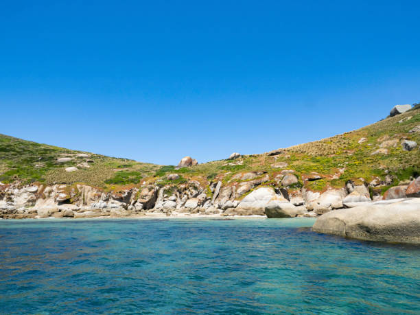 istock Looking at view of ocean and beautiful rock formations 1446344493