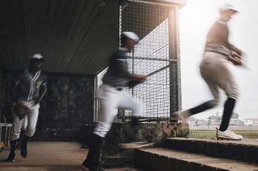 Baseball, running and sports athlete team with fast energy ready to start a game on a sport field. Fitness, exercise teamwork workout and training collaboration of a cardio and people together