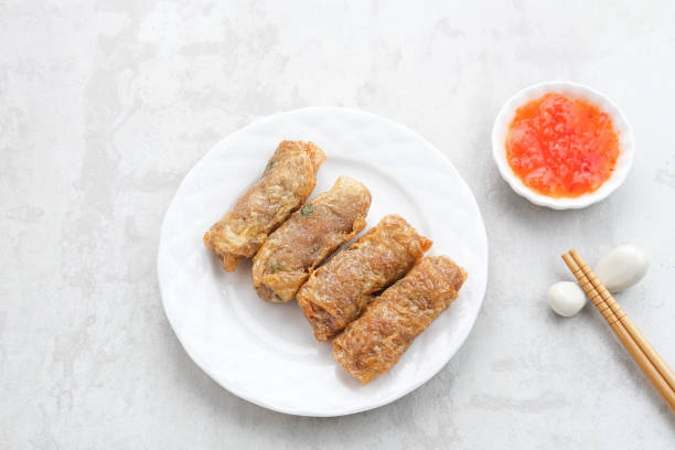 Lumpia Kulit Tahu, chicken shrimp spring rolls wrapped in tofu skin.