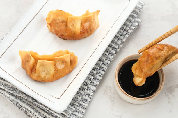 Gyoza, deep fried dumpling with juicy chicken and cabbage.