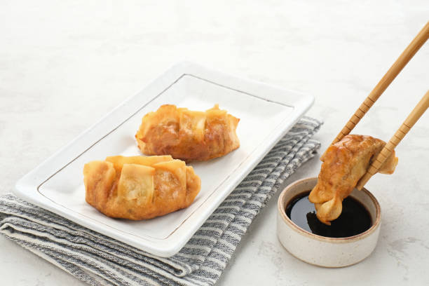 Gyoza, deep fried dumpling with juicy chicken and cabbage.