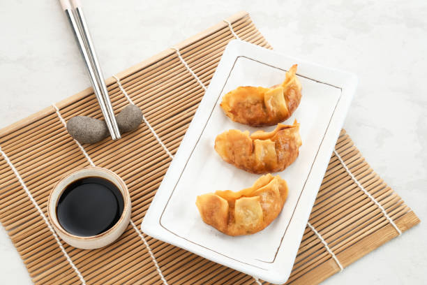 Gyoza, deep fried dumpling with juicy chicken and cabbage.