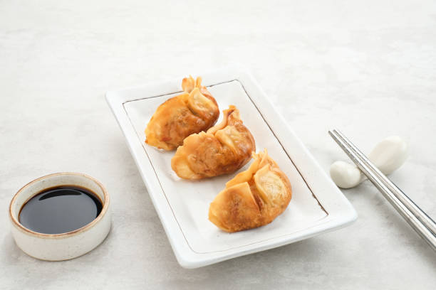 Gyoza, deep fried dumpling with juicy chicken and cabbage.