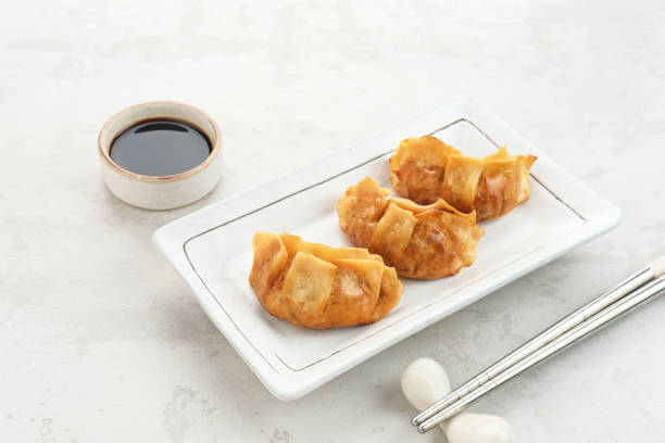 Gyoza, deep fried dumpling with juicy chicken and cabbage.