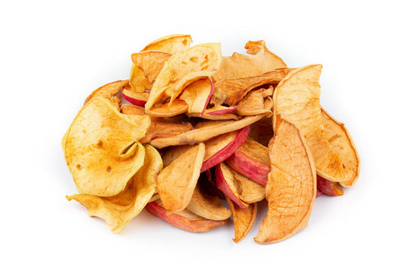 istock Homemade sun-dried organic apple slices, crispy apple chips on white background. 1446348405