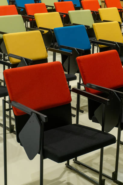 istock Rows of colourful seats in the hall 1446348758