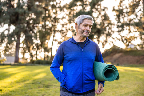 istock Senior couple with yoga mats 1446349914