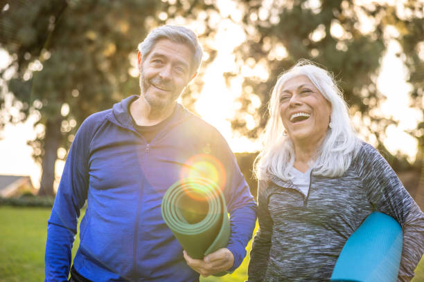 istock Senior couple with yoga mats 1446349975