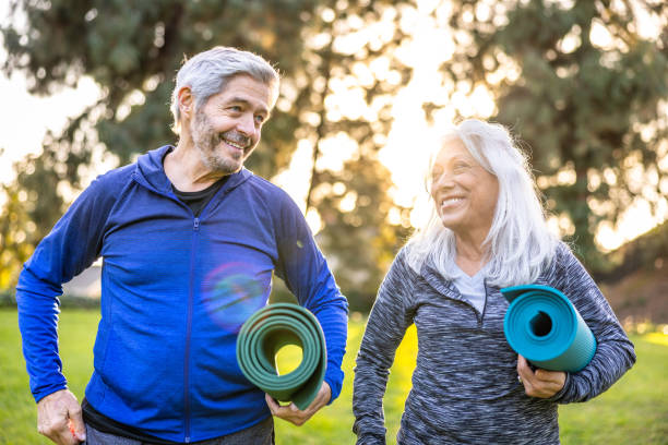 istock Senior couple with yoga mats 1446349983