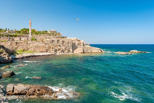 Coastline of Portopalo, in southern Sicily, with the ruins of an old factory for the manufacturing of tuna fish