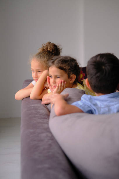 istock Happy little siblings having fun playing together at home 1446356408