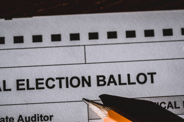 istock Selective focus on a generic election ballot with a pencil on top. 1446357505