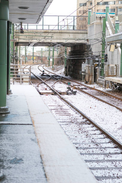 istock Snow covered train tracks seen from inside a train station during a cold winter afternoon 1446357526