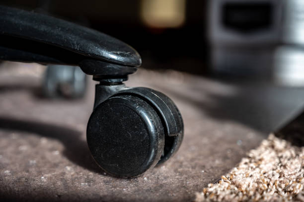 istock Transition between carpet and hard protective mat for a home office rolling desk chair 1446357636