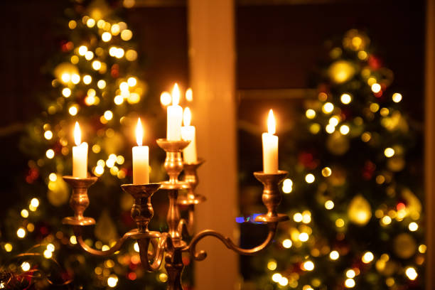 Burning Candles on Christmas Eve dinning table in Italy