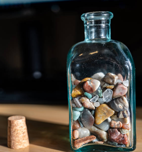 collection of memories half filling a glass jar.