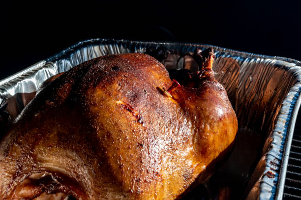 istock Pop-up thermometer timer in a smoked turkey 1446358542