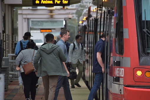 Commuters board a Metro Train in Houston (1 photo of 4)