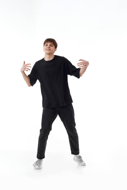 istock young man in black t-shirt and jeans dancing 1446361822