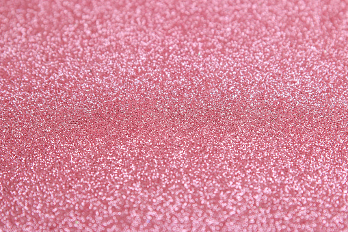 Beautiful texture of pink sparkles. glitter background. shiny texture