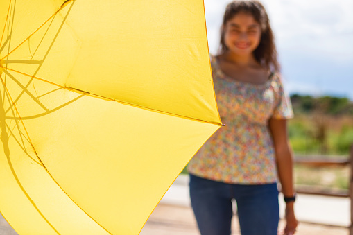 Western USA Generation Z Young Adult Hispanic Mexican American Female with Yellow Umbrella Outdoors Summer Portraits Photo Series
