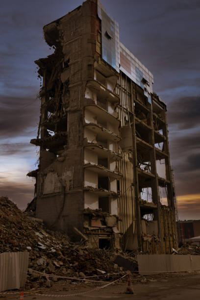 Old building being demolished to make room for new architecture. Construction Demolition Site. Destroyed building, can be used as demolition, earthquake, bomb, terrorist attack or natural disaster