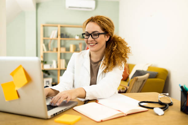 istock Female doctor using laptop in video call 1446371806