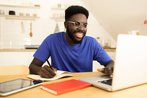 istock Young freelancer working at his home office 1446372619